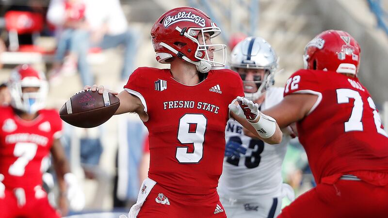 Fresno State quarterback Jake Haener passes downfield against Nevada during the first half of...