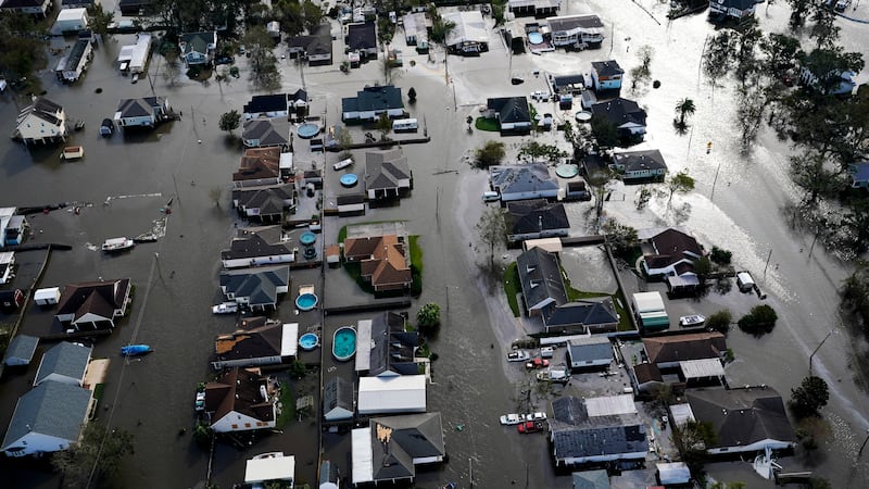 FILE - Homes are flooded in the aftermath of Hurricane Ida, Monday, Aug. 30, 2021, in Jean...