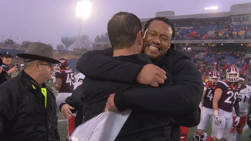 Marcus Freeman hugs Luke Fickell after UC wins the Military Bowl