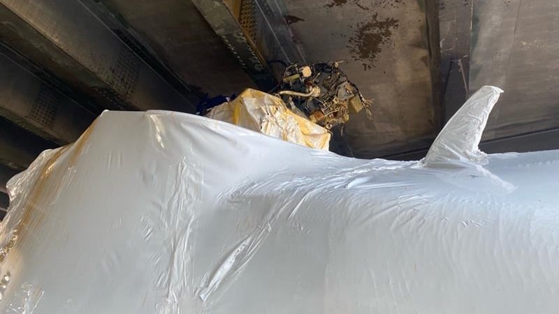 Officials respond after helicopter stuck under I-12 on S. Range Avenue in Denham Springs.