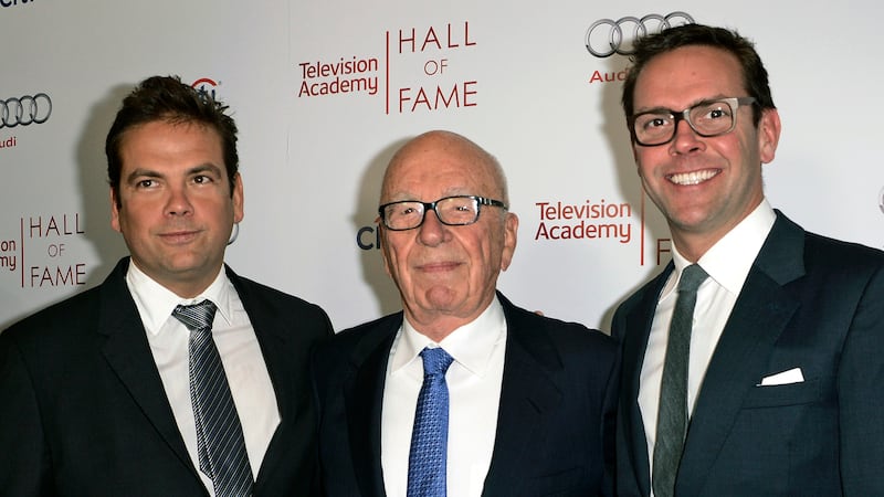 FILE - Rupert Murdoch, Chair of Fox Corporation and Executive Chairman of News Corp, center,...