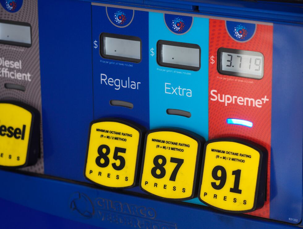 The price is shown on the pump as a motorist fuels a vehicle at an Exxon station Wednesday,...