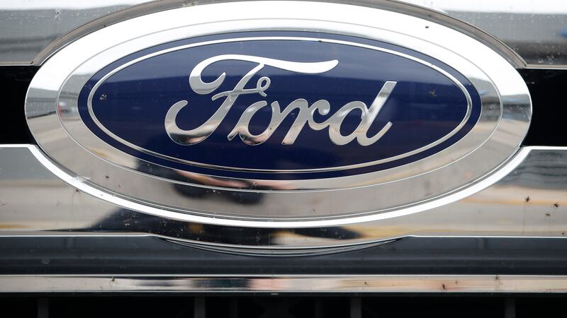 FILE - The Ford company logo is pictured, Oct. 20, 2019, at a Ford dealership in Littleton,...