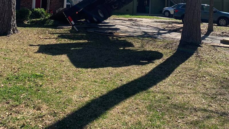 Crane truck crashes through Slidell home