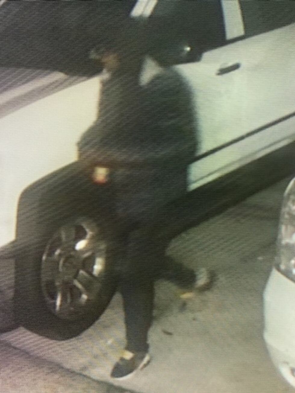 Surveillance image of person who broke into a vehicle in Baker and stole a gun from it
