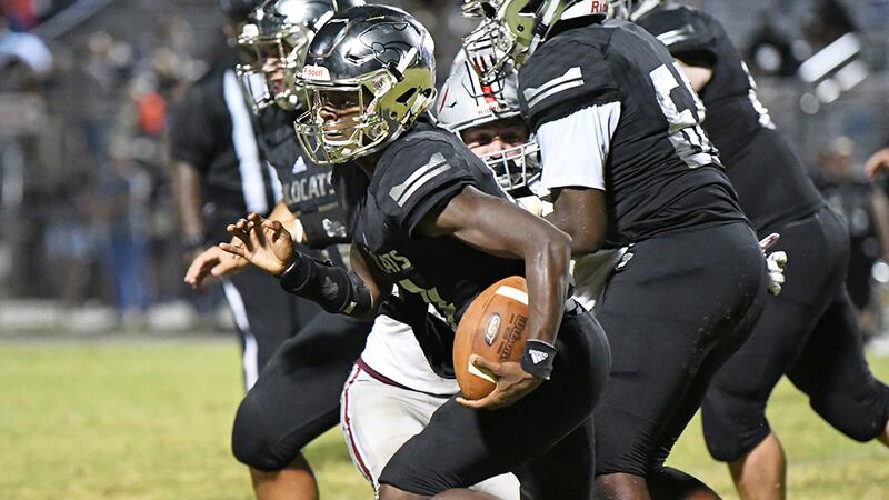 Central quarterback Sam Kenerson (No. 14)