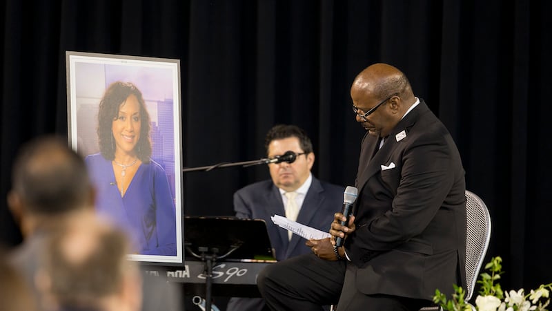Glynn Boyd, Nancy's beloved husband, sings during his eulogy at her memorial service.