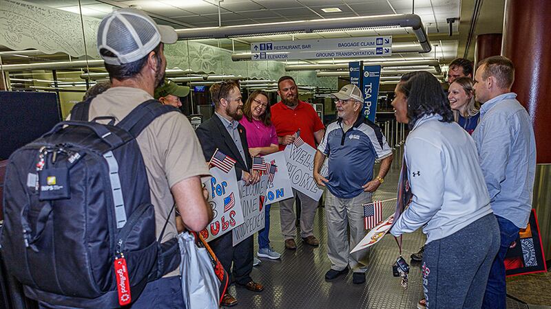 Gordon Eatley, center, is welcomed home by fellow student veterans and staff members of UL...