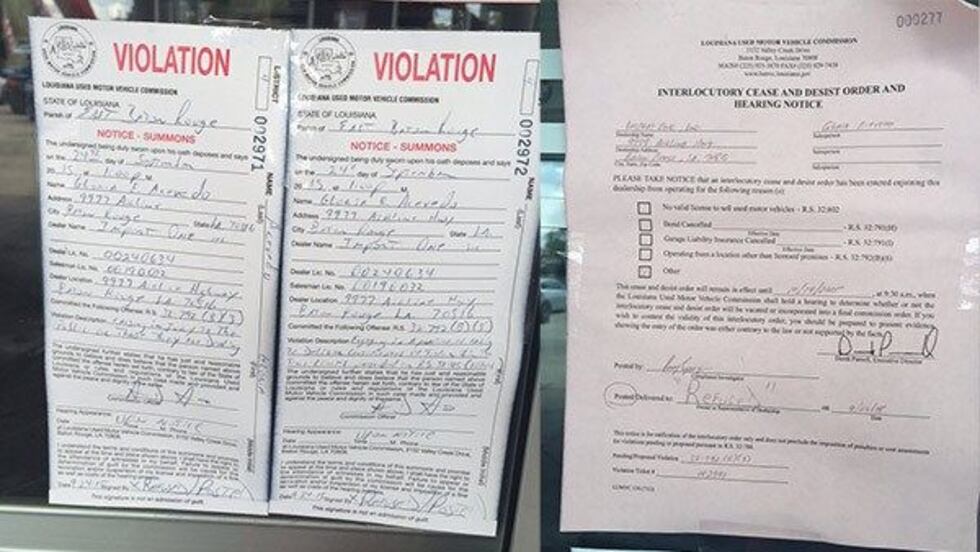 Notices posted on the doors at Import One Used Car business (Source: WAFB)