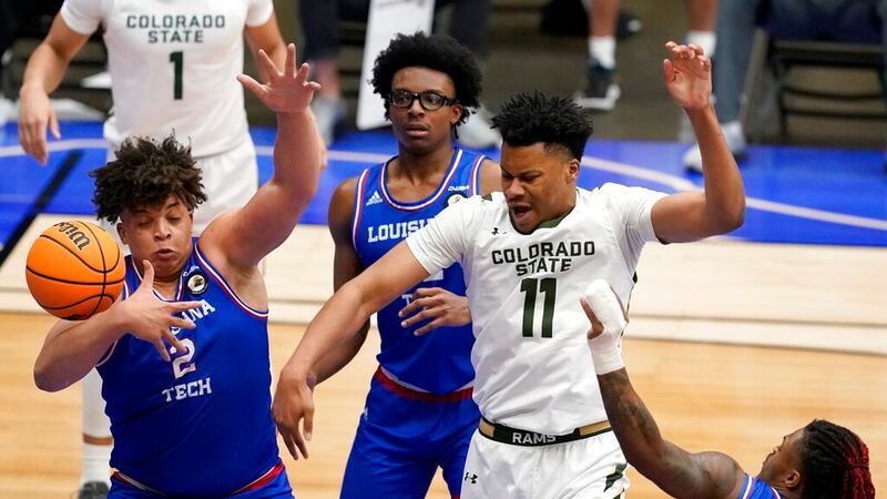 Louisiana Tech forward Kenneth Lofton Jr. (2) Isaiah Crawford, rear, and Cobe Williams, bottom...