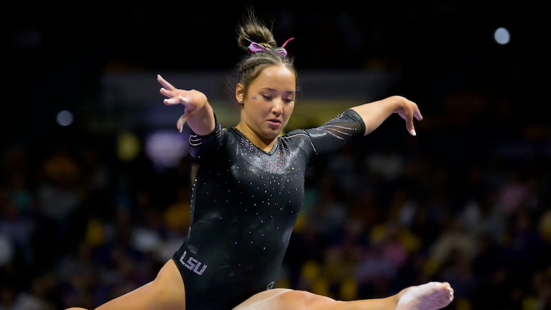LSU gymnast Aleah Finnegan performs on the balance beam during an NCAA gymnastics meet against...